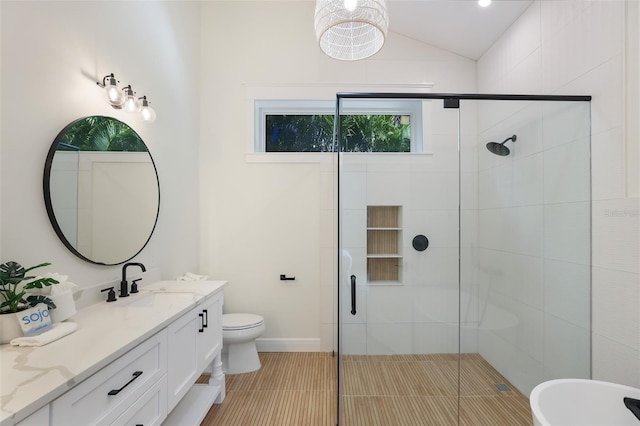305 73rd St, Holmes Beach, FL 34217 - bathroom featuring lofted ceiling, vanity, tile patterned flooring, and a stall shower