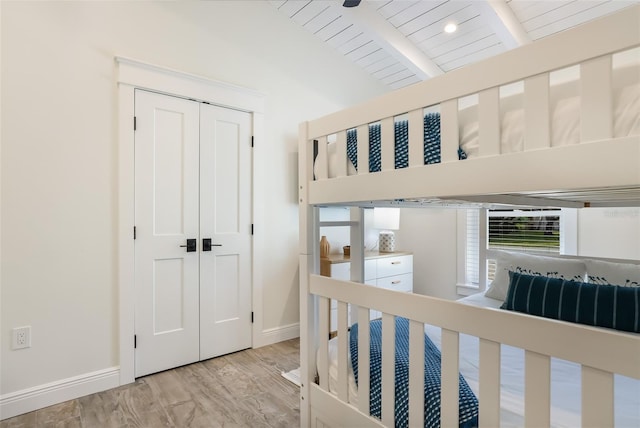 305 73rd St, Holmes Beach, FL 34217 - bedroom featuring baseboards, a closet, vaulted ceiling with beams, and wooden ceiling
