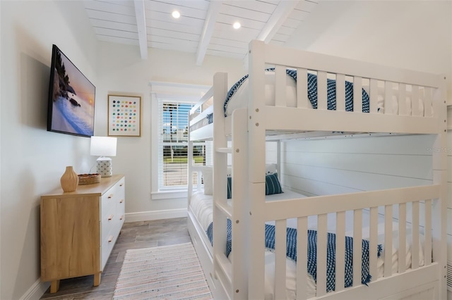 305 73rd St, Holmes Beach, FL 34217 - bedroom featuring lofted ceiling with beams, wood finished floors, baseboards, and wooden ceiling