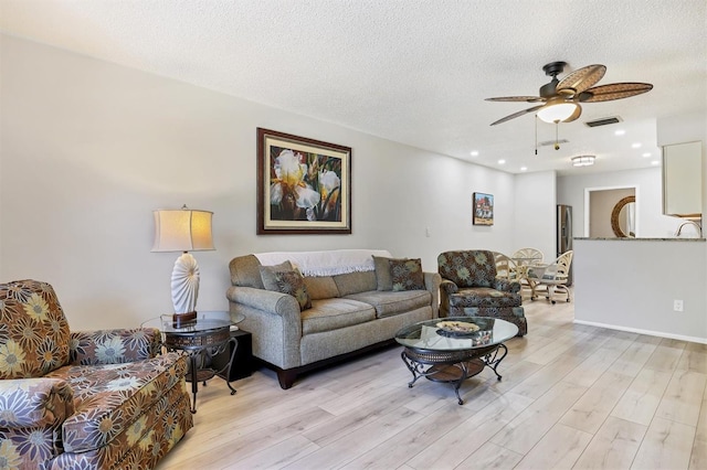 4169 66th Street Cir W Unit 4169, Bradenton, FL 34209 - living area featuring light wood finished floors, a ceiling fan, a textured ceiling, and recessed lighting
