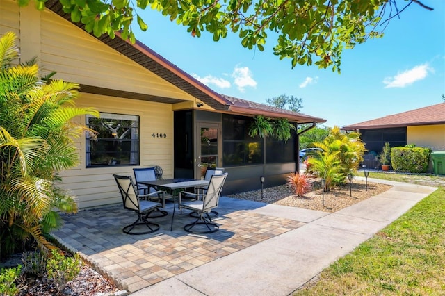 4169 66th Street Cir W Unit 4169, Bradenton, FL 34209 - view of patio with a sunroom and outdoor dining space