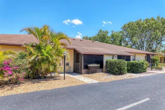 4169 66th Street Cir W Unit 4169, Bradenton, FL 34209 - ranch-style house featuring stucco siding and a sunroom