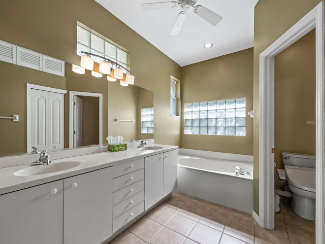 3835 Alamanda Dr, Sarasota, FL 34238 - bathroom with toilet, tile patterned floors, a bath, a ceiling fan, and double vanity
