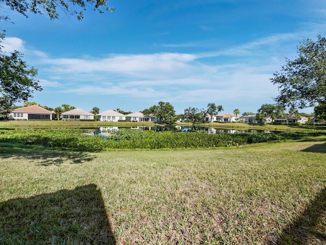 3835 Alamanda Dr, Sarasota, FL 34238 - view of grassy yard with a water view and a residential view