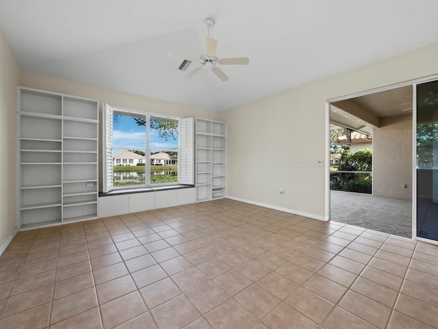 3835 Alamanda Dr, Sarasota, FL 34238 - tiled spare room featuring a ceiling fan, baseboards, and vaulted ceiling