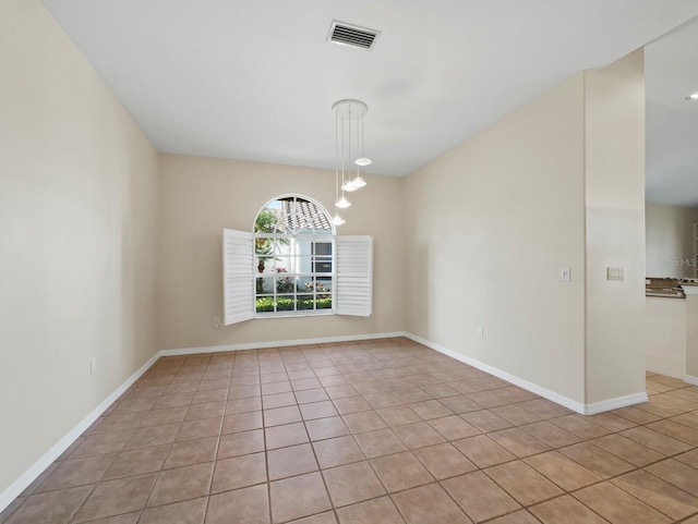 3835 Alamanda Dr, Sarasota, FL 34238 - empty room featuring light tile patterned floors and baseboards