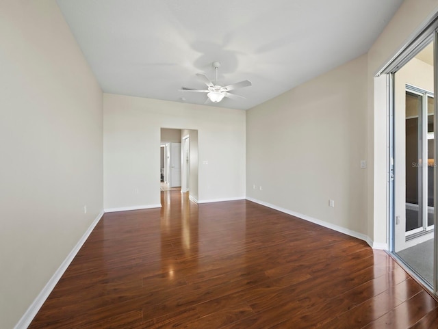 3835 Alamanda Dr, Sarasota, FL 34238 - empty room with wood finished floors, a ceiling fan, and baseboards