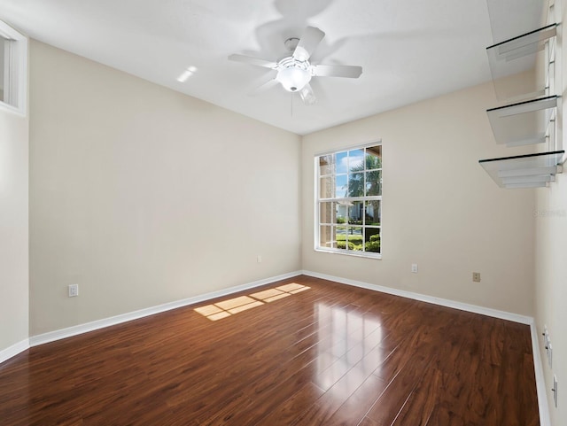 3835 Alamanda Dr, Sarasota, FL 34238 - empty room with baseboards, wood finished floors, and a ceiling fan