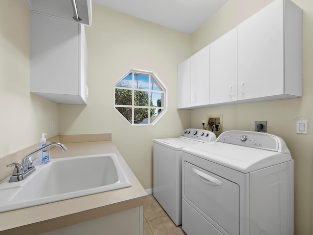 3835 Alamanda Dr, Sarasota, FL 34238 - washroom featuring cabinet space, independent washer and dryer, and light tile patterned flooring