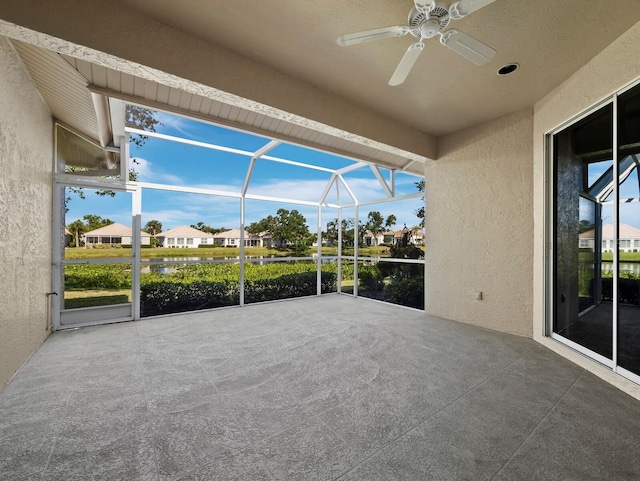 3835 Alamanda Dr, Sarasota, FL 34238 - view of patio with a ceiling fan, glass enclosure, and a residential view