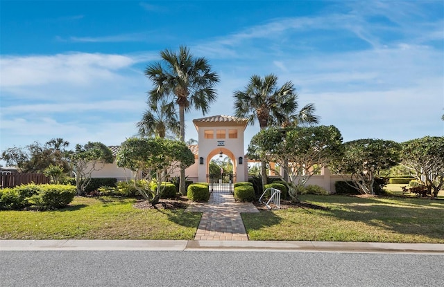 3835 Alamanda Dr, Sarasota, FL 34238 - view of front of property featuring a gate and stucco siding