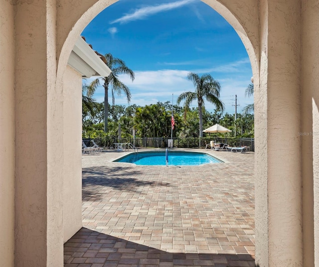3835 Alamanda Dr, Sarasota, FL 34238 - community pool with a patio and view of scattered trees