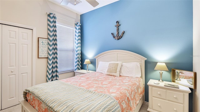 carpeted bedroom featuring ceiling fan and a closet