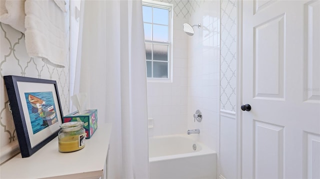 bathroom featuring shower / tub combo and wallpapered walls