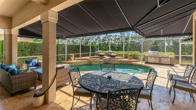 view of swimming pool with a fenced in pool, an in ground hot tub, a patio area, and an outdoor kitchen