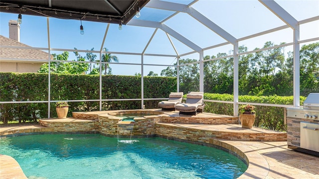 view of swimming pool with an outdoor kitchen, a fenced in pool, an in ground hot tub, a patio area, and a lanai