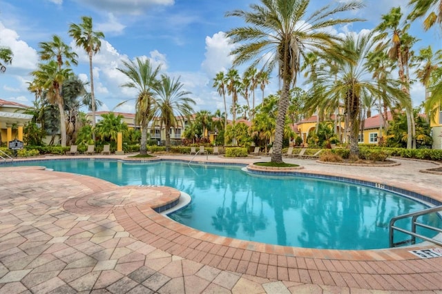 community pool with a patio area