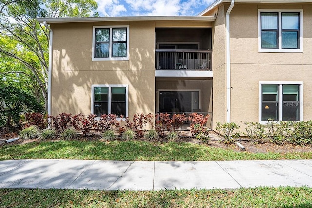 4061 Crockers Lake Blvd Unit 2618, Sarasota, FL 34238 - view of front of property featuring a balcony and stucco siding