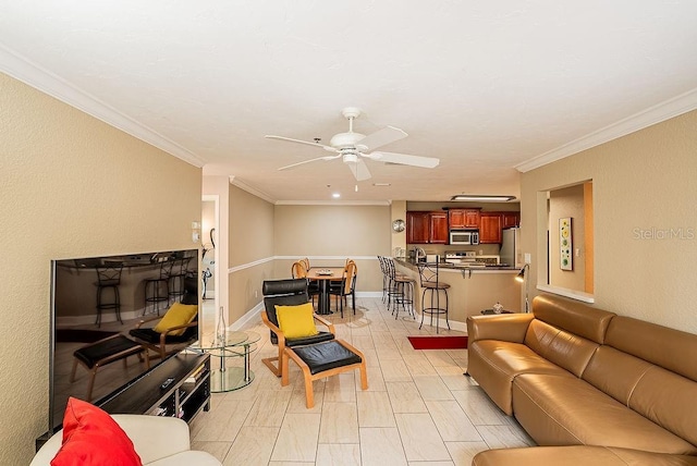 4061 Crockers Lake Blvd Unit 2618, Sarasota, FL 34238 - living room featuring ceiling fan, baseboards, and ornamental molding