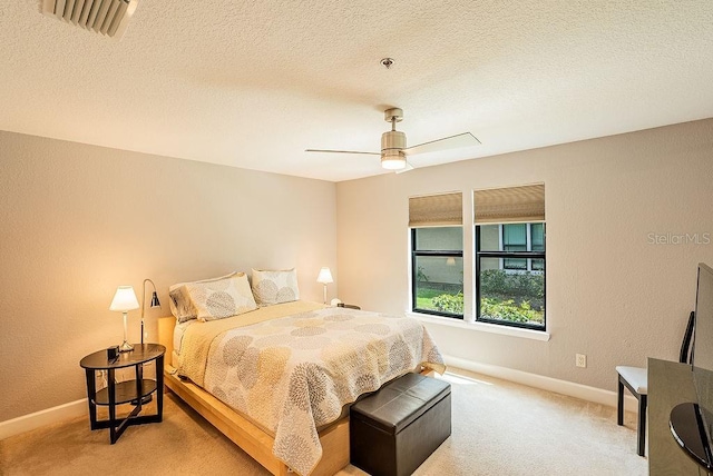 4061 Crockers Lake Blvd Unit 2618, Sarasota, FL 34238 - bedroom featuring light carpet, a ceiling fan, visible vents, and baseboards