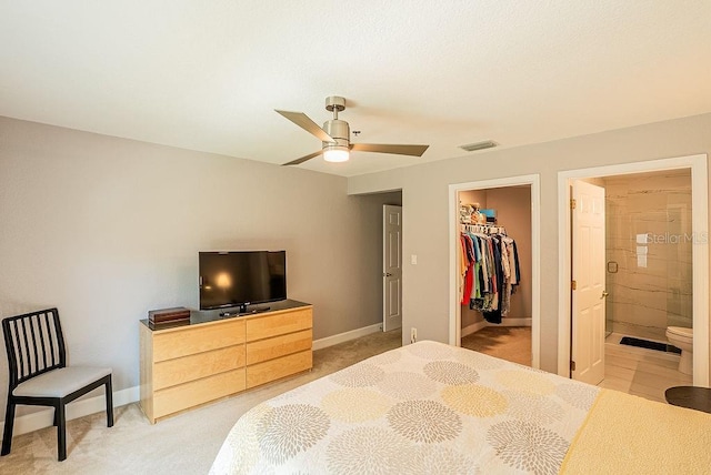 4061 Crockers Lake Blvd Unit 2618, Sarasota, FL 34238 - bedroom featuring a closet, a walk in closet, ensuite bath, baseboards, and visible vents