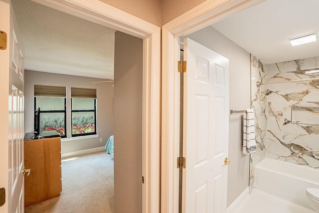 4061 Crockers Lake Blvd Unit 2618, Sarasota, FL 34238 - full bathroom with washtub / shower combination, a textured ceiling, and toilet