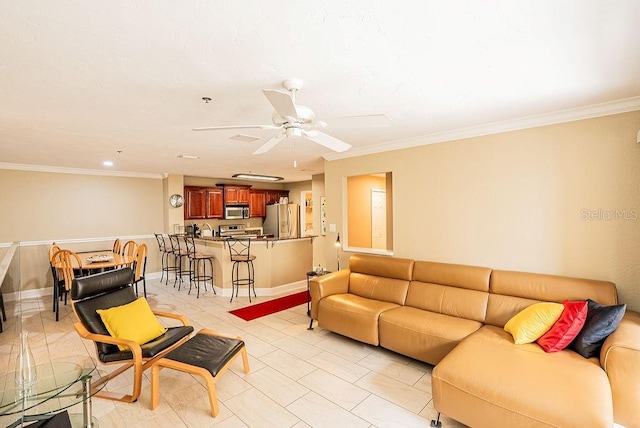 4061 Crockers Lake Blvd Unit 2618, Sarasota, FL 34238 - living area with crown molding, baseboards, and ceiling fan