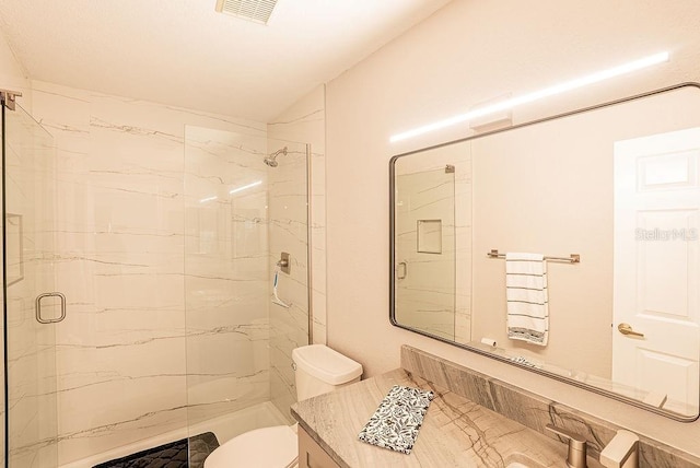 4061 Crockers Lake Blvd Unit 2618, Sarasota, FL 34238 - bathroom featuring visible vents, toilet, a stall shower, and vanity