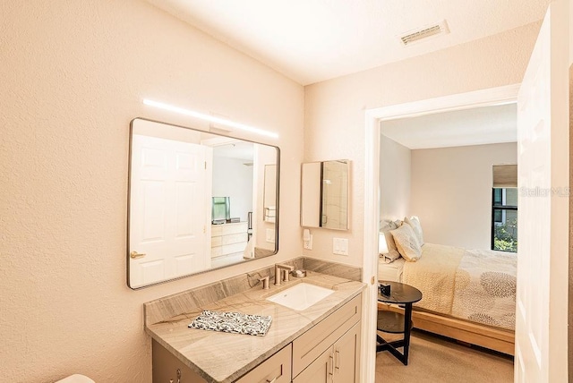 4061 Crockers Lake Blvd Unit 2618, Sarasota, FL 34238 - ensuite bathroom with visible vents, vanity, and connected bathroom