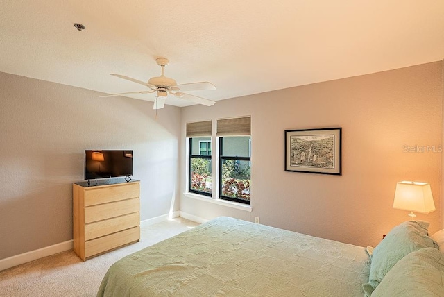 4061 Crockers Lake Blvd Unit 2618, Sarasota, FL 34238 - bedroom with a ceiling fan, baseboards, and light colored carpet