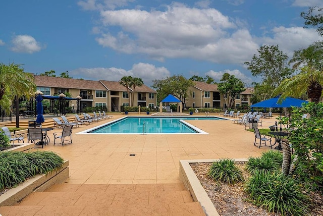 4061 Crockers Lake Blvd Unit 2618, Sarasota, FL 34238 - pool featuring a residential view, a patio area, and fence