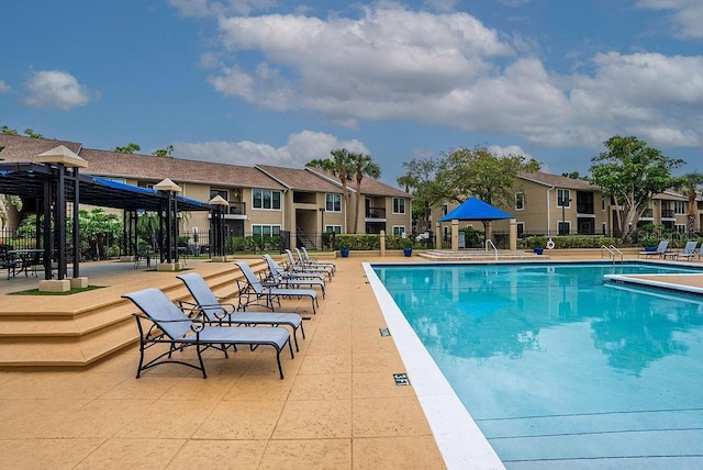 4061 Crockers Lake Blvd Unit 2618, Sarasota, FL 34238 - community pool featuring a gazebo, fence, and a residential view