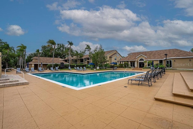 4061 Crockers Lake Blvd Unit 2618, Sarasota, FL 34238 - community pool featuring a patio