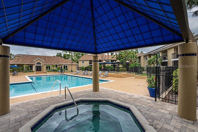 4061 Crockers Lake Blvd Unit 2618, Sarasota, FL 34238 - pool with a patio area, a hot tub, and fence
