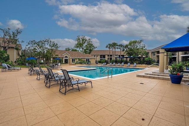 4061 Crockers Lake Blvd Unit 2618, Sarasota, FL 34238 - community pool featuring a patio area