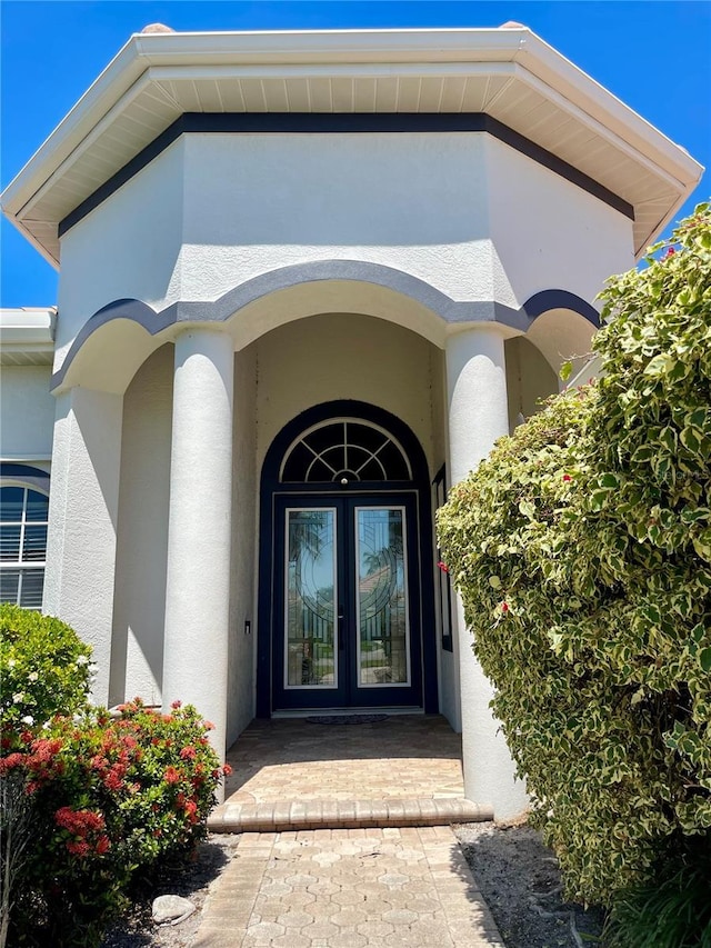 2980 Seasons Blvd, Sarasota, FL 34240 - property entrance with french doors and stucco siding