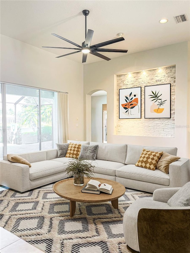 2980 Seasons Blvd, Sarasota, FL 34240 - living area with arched walkways, ceiling fan, and recessed lighting