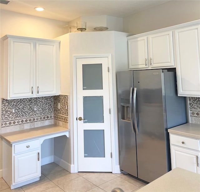 2980 Seasons Blvd, Sarasota, FL 34240 - kitchen featuring stainless steel fridge with ice dispenser, light countertops, white cabinetry, and recessed lighting