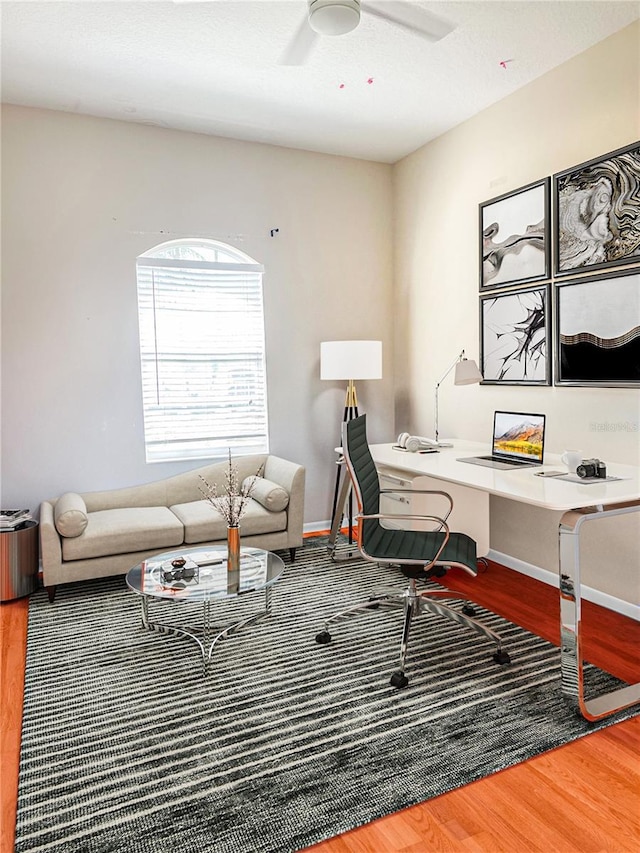 2980 Seasons Blvd, Sarasota, FL 34240 - home office with wood finished floors, a ceiling fan, and baseboards