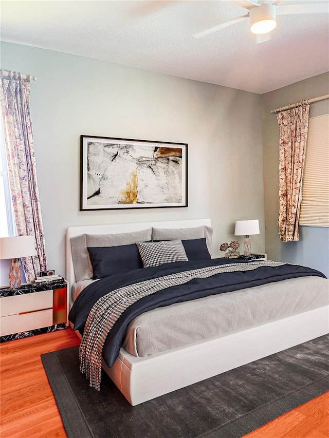2980 Seasons Blvd, Sarasota, FL 34240 - bedroom featuring wood finished floors and a ceiling fan