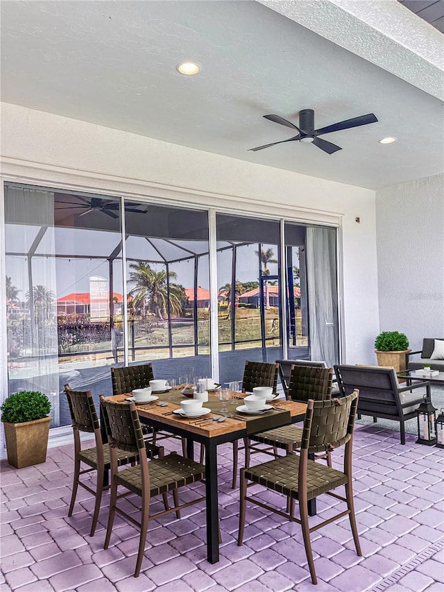 2980 Seasons Blvd, Sarasota, FL 34240 - view of patio with ceiling fan, a lanai, and outdoor dining area