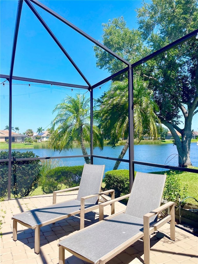 2980 Seasons Blvd, Sarasota, FL 34240 - view of patio / terrace featuring a water view and glass enclosure
