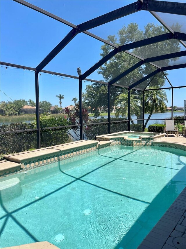 2980 Seasons Blvd, Sarasota, FL 34240 - view of swimming pool featuring a lanai, a pool with connected hot tub, and a patio