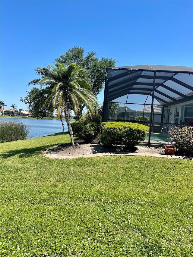 2980 Seasons Blvd, Sarasota, FL 34240 - view of green lawn featuring glass enclosure and a water view