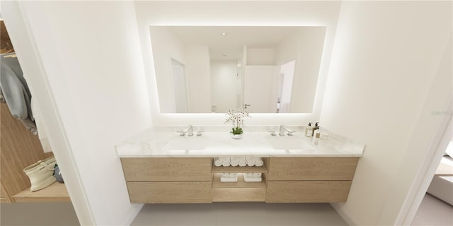 4950 Remington Dr Unit 304, Sarasota, FL 34234 - bathroom with baseboards, tile patterned floors, a sink, and double vanity