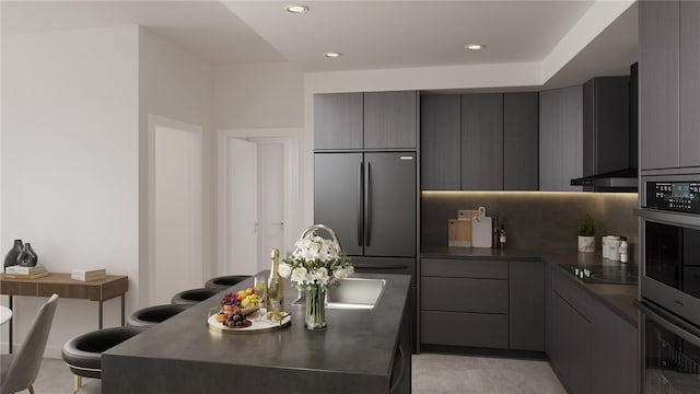 4950 Remington Dr Unit 304, Sarasota, FL 34234 - kitchen with black electric stovetop, dark countertops, modern cabinets, gray cabinets, and built in fridge