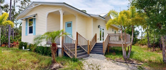 exterior space with stairs and a deck