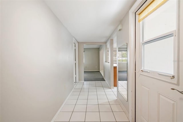 5521 Riverbluff Cir Unit V-10, Sarasota, FL 34231 - corridor featuring baseboards and light tile patterned floors