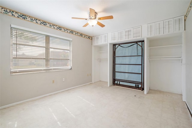 5521 Riverbluff Cir Unit V-10, Sarasota, FL 34231 - unfurnished bedroom with ceiling fan and baseboards