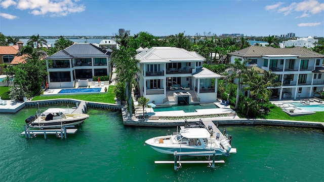 1435 Westway Dr, Sarasota, FL 34236 - back of property featuring boat lift, a balcony, a patio area, and an outdoor pool